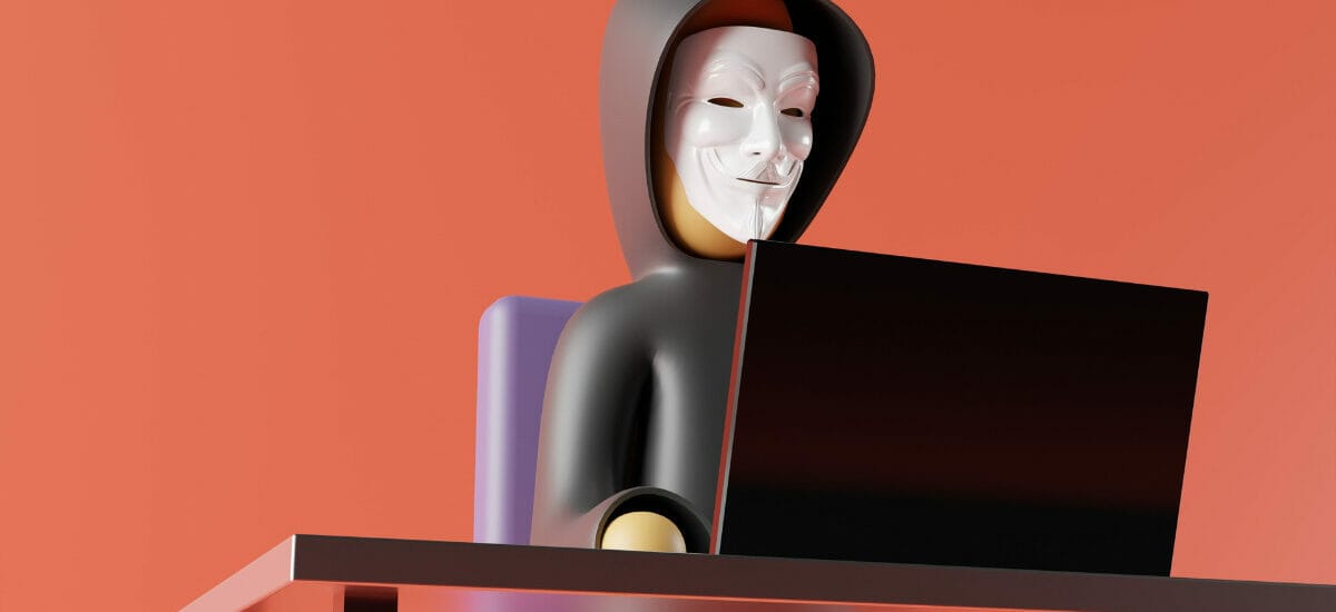 A doll wearing a Guy Fawkes mask and a hoodie in front of an orange background, implying its a hacker and the organization needs cybersecurity