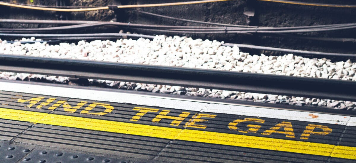 "Mind the Gap" warning painted in yellow on the ground at the London Underground