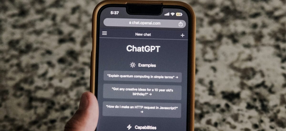 A person’s hand holding a phone with the ChatGPT app open, reflecting the importance of AI in an omnichannel approach