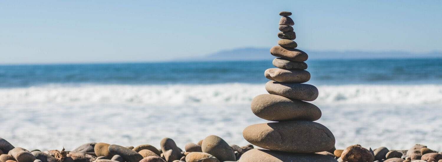 A balanced pile of rocks to represent mental health and personal balance