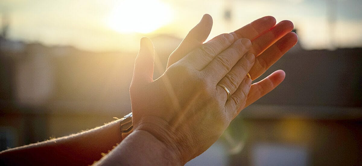 An image of two hands applauding in recognition for a job well done