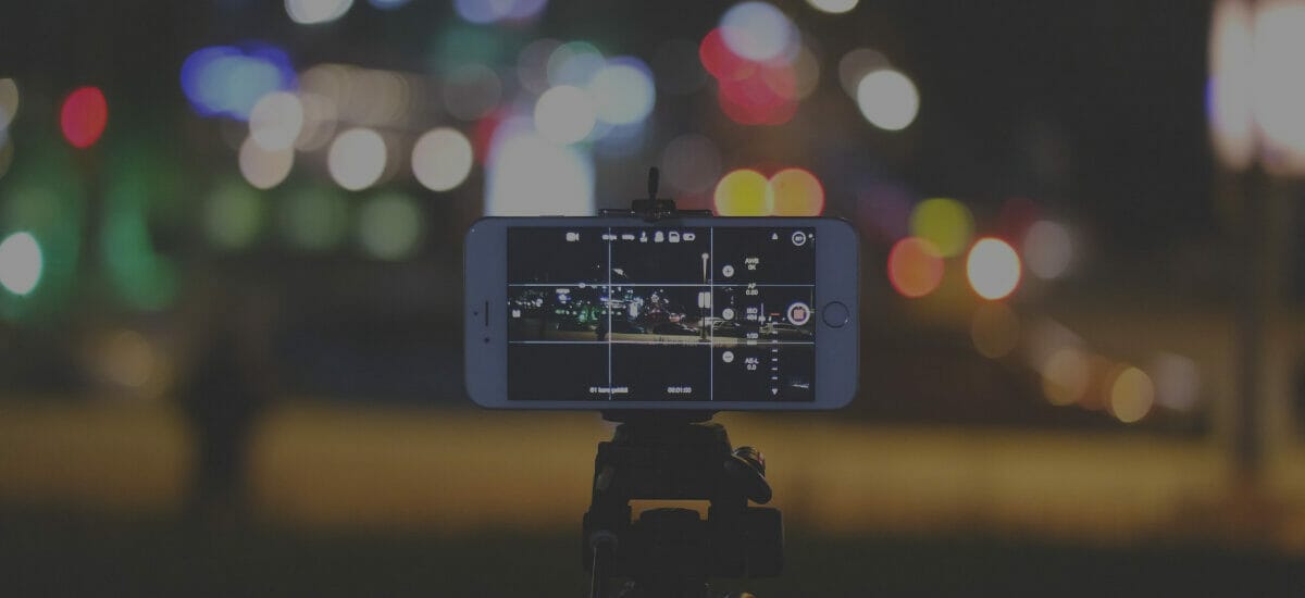 Image of iPhone recording short-form video content at night.